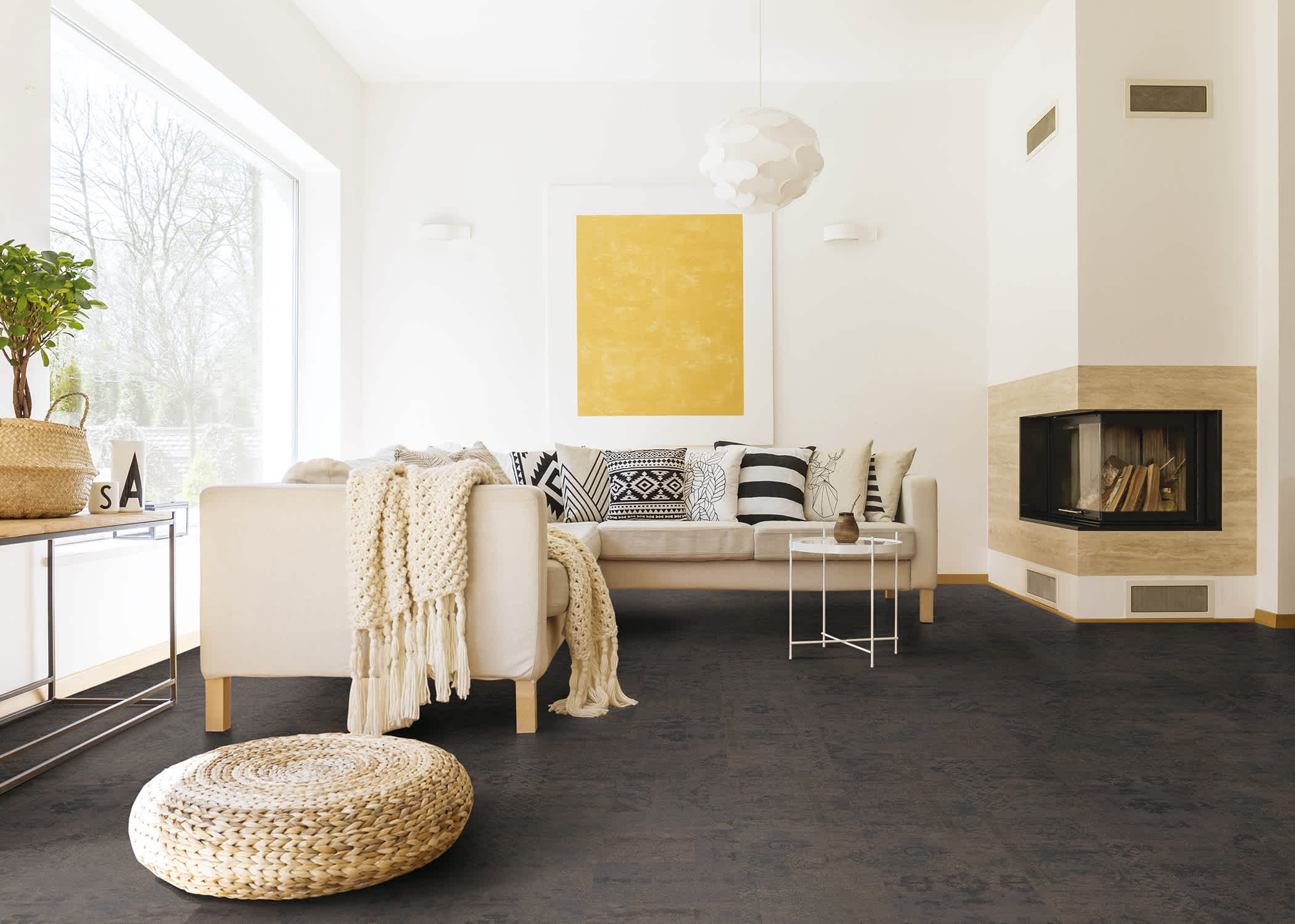 brown cork floor in living room with white sofa and fireplace