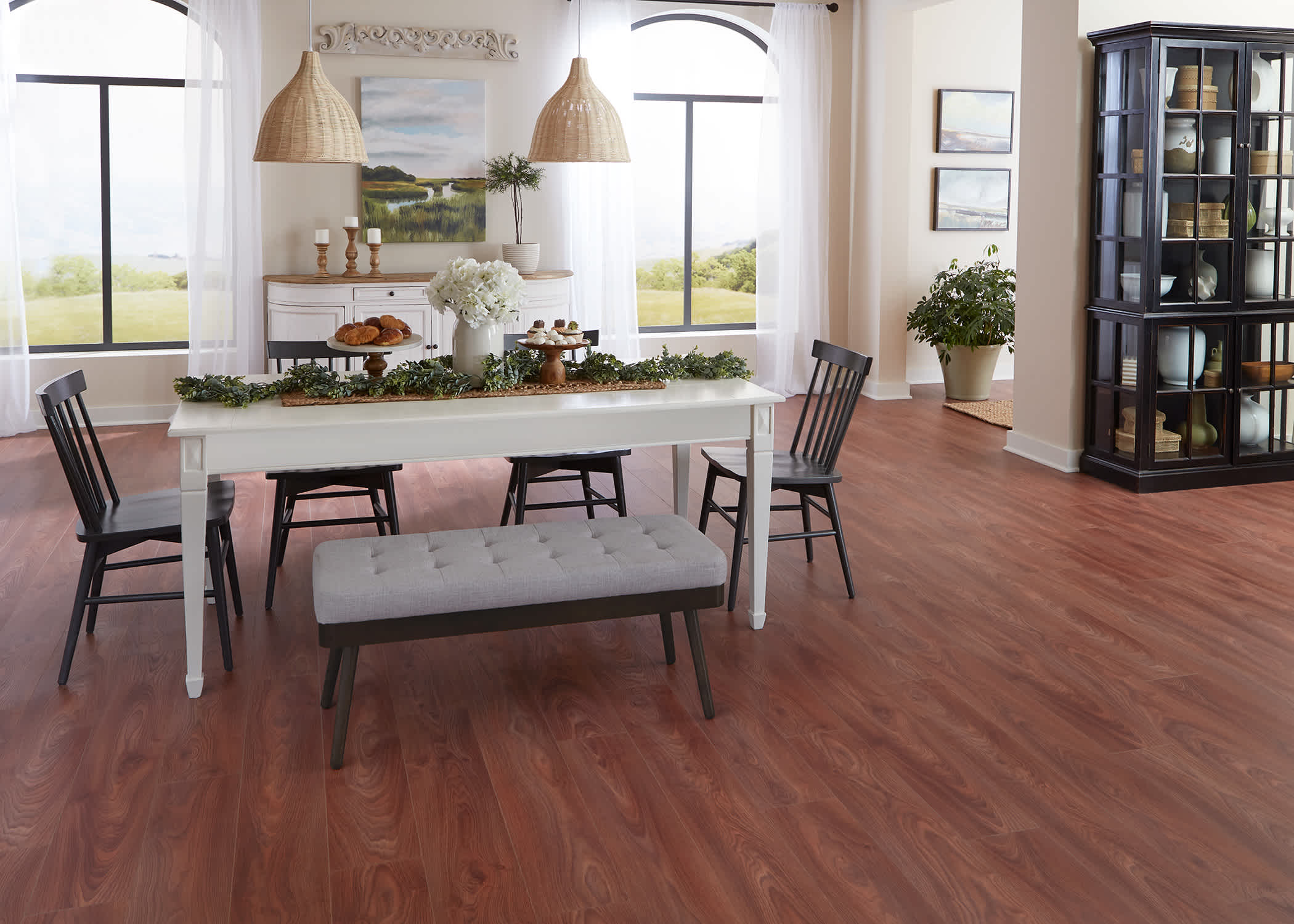 Brazilian Cherry Waterproof Hybrid Resilient Flooring installed in a dining room