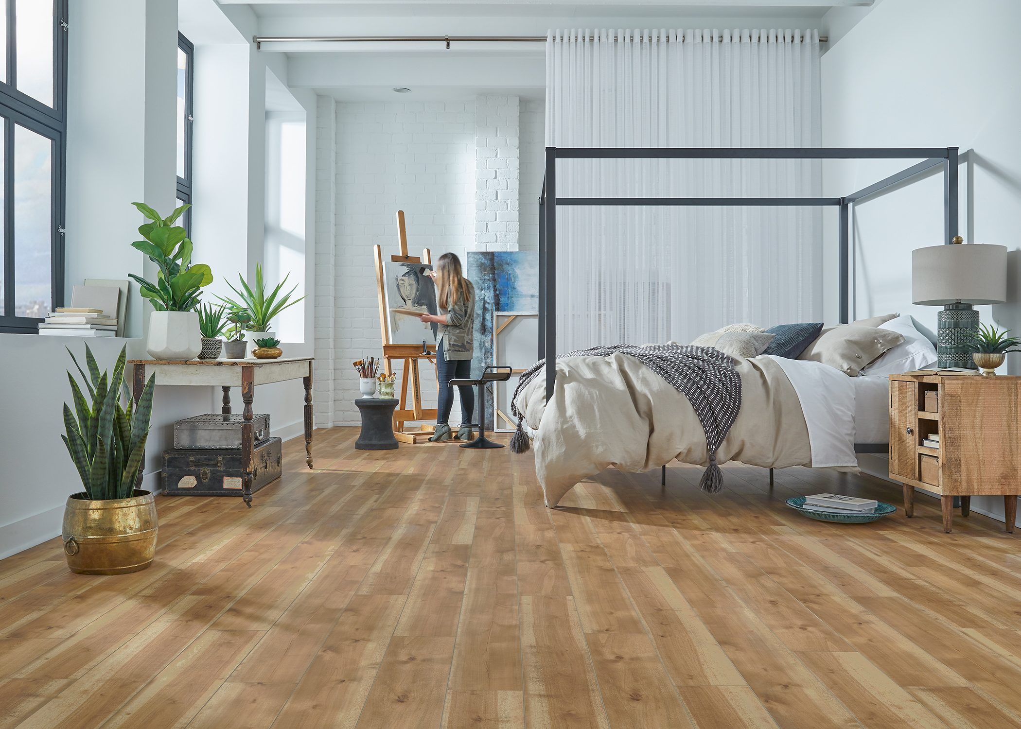 bedroom with wood look vinyl plank flooring