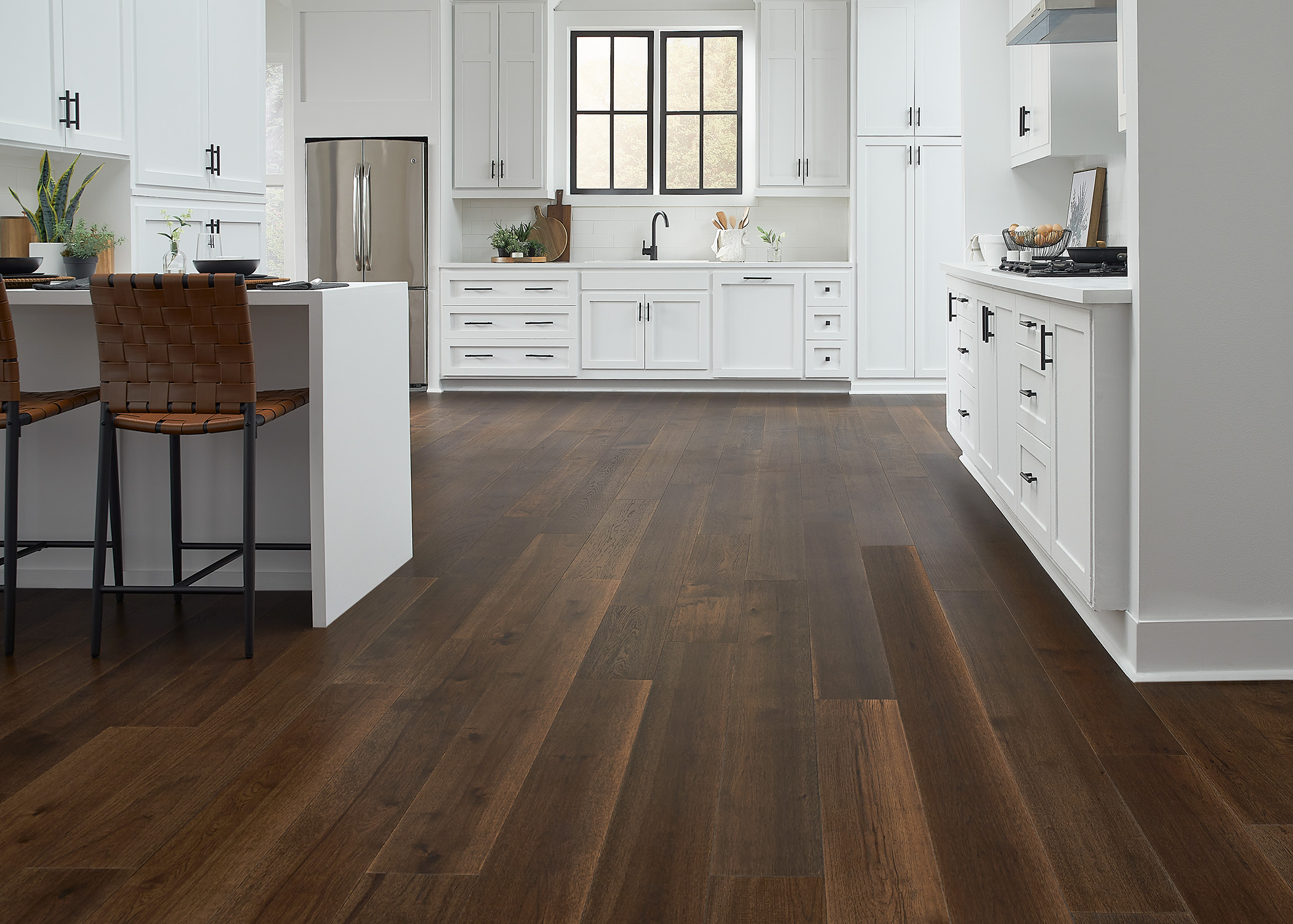 bright kitchen with white cabinets and AquaSeal 7mm+pad Lake Superior Hickory Water-Resistant Distressed Engineered Hardwood Flooring