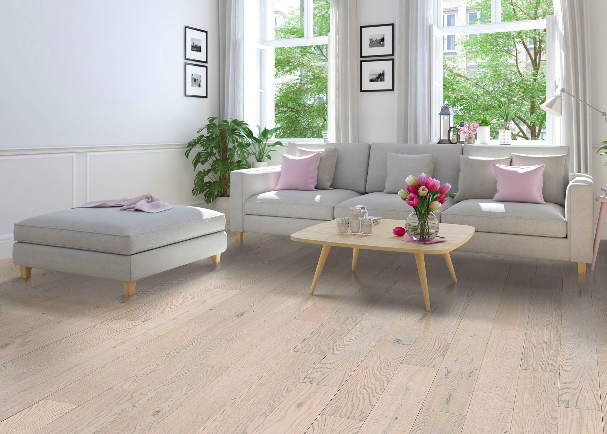 living room with hardwood flooring and pink accent pillows and matching flowers