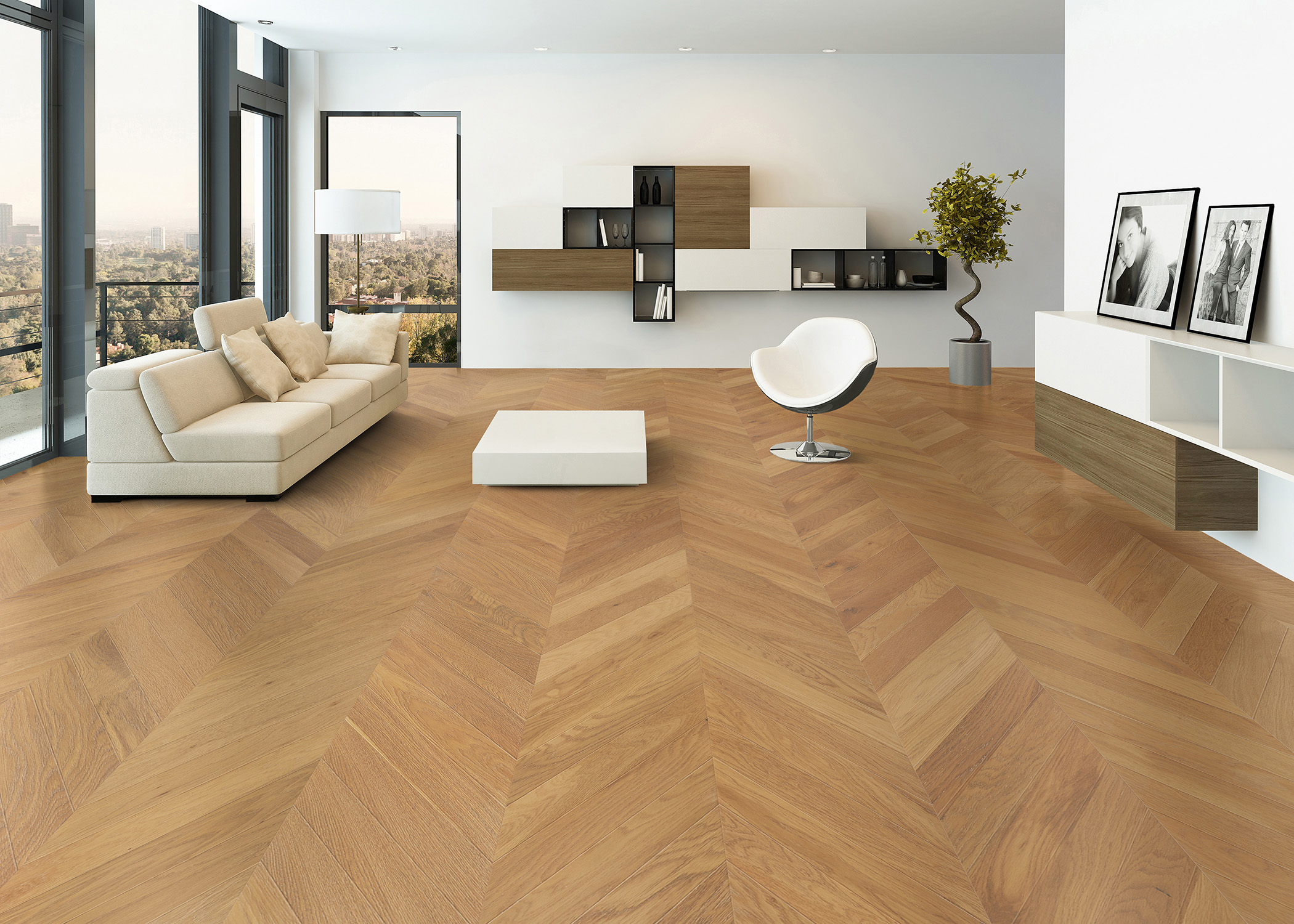 blonde chevron engineered hardwood floor in living room with cream sofa with off white barrel chair with metal base and low square cocktail table