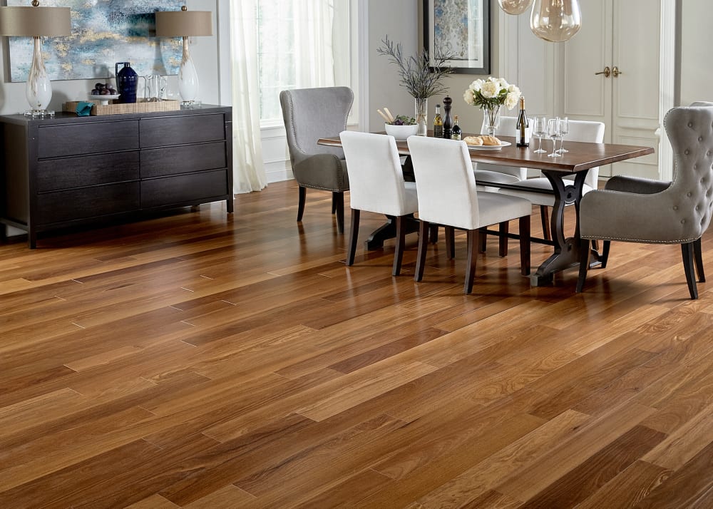 1/2 in. x 5 1/8 in. Cumaru Engineered Hardwood Flooring in dining room with dark brown dining table and gray and off white dining chairs plus dark brown credenza