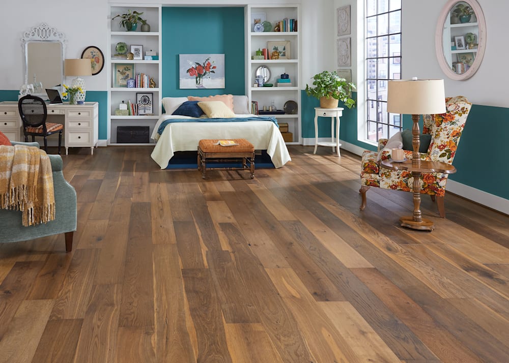 1/2" x 7.4 in. Willow Manor Oak Distressed Engineered Hardwood Flooring in bedroom with desk area and murphy bed plus turquoise walls and antique floral accent chair