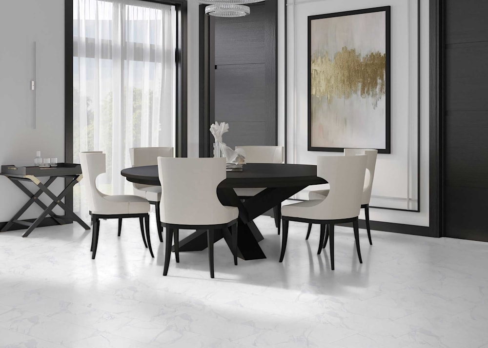 12 in x 24 in Vertice Opaco Porcelain Tile Flooring in dining room with dark brown dining table with white chairs and black walls