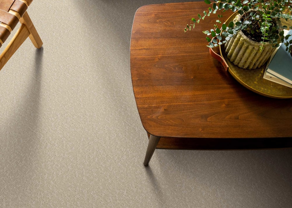 SHW Lost Lake Plateau in living room with dark brown wood table with oval tray and small plant in vase